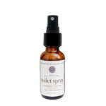 Bottle of all-natural toilet spray with a label on a white background. Eucalyptus/lavender scented